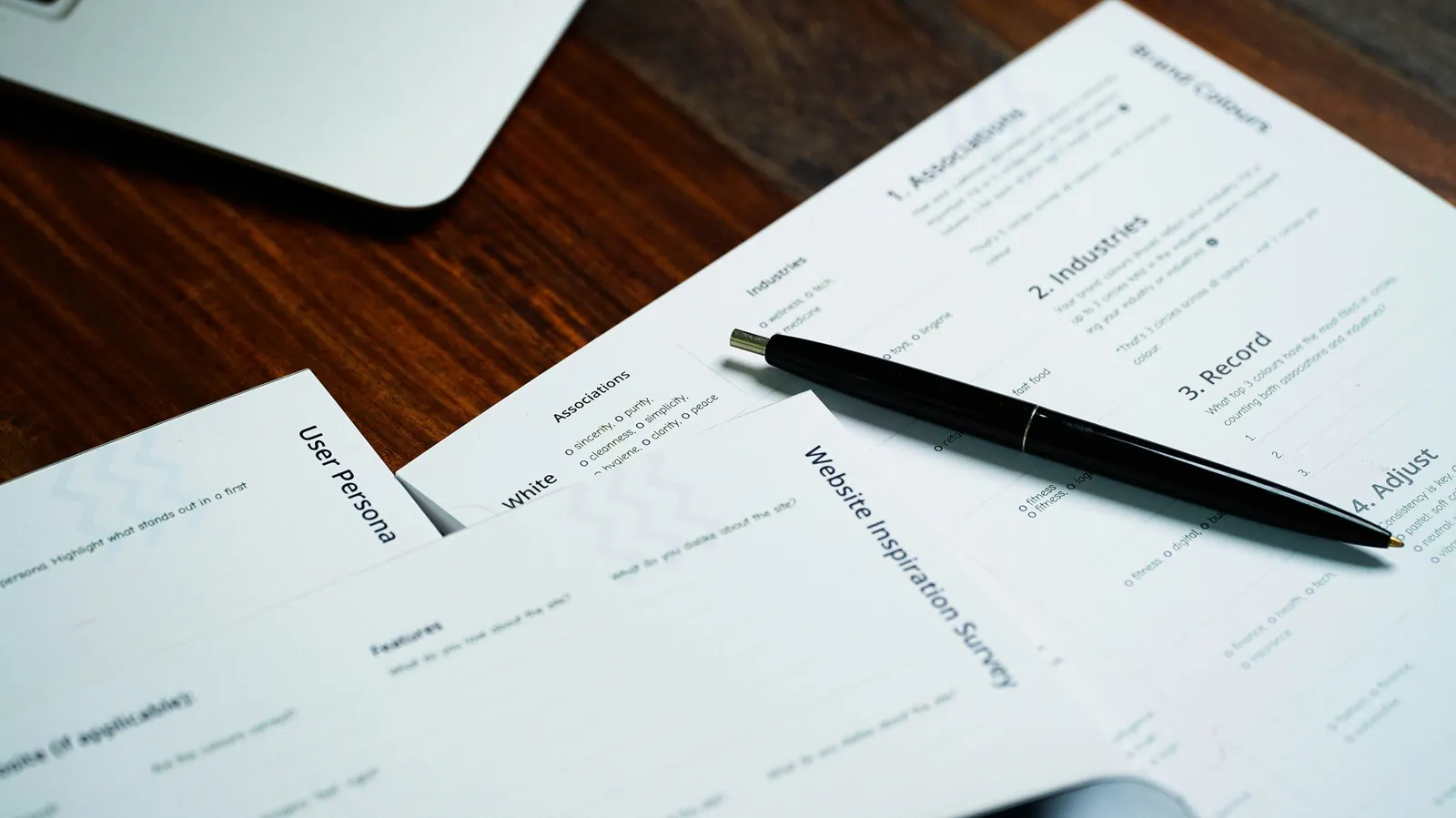 Business planning documents and a pen on a desk